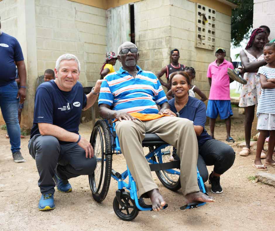 Geoff distributes wheelchairs following our Move for Mobility success